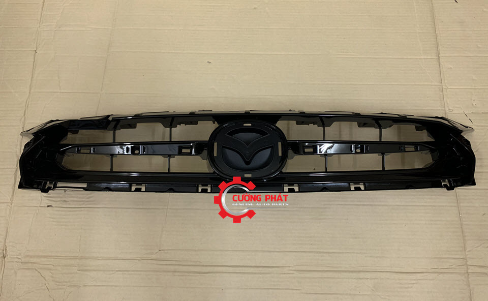 Mat-ca-lang-Mazda-2-2015-DA6J5071XA-ga-lang (2) Hình ảnh mặt ca lăng Mazda 2 2015 chính hãng