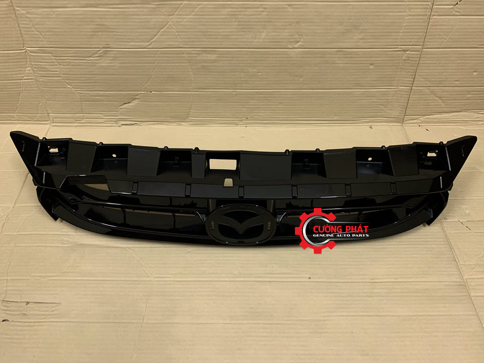 Mat-ca-lang-Mazda-2-2015-DA6J5071XA-ga-lang Mặt sau ga lăng Mazda 2 2015 chính hãng